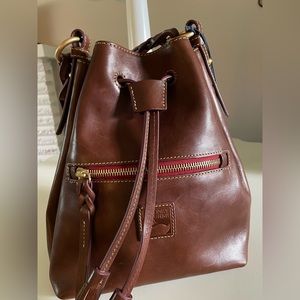 Dooney and Bourke Florentine Small Logan Drawstring with green suede and tassels